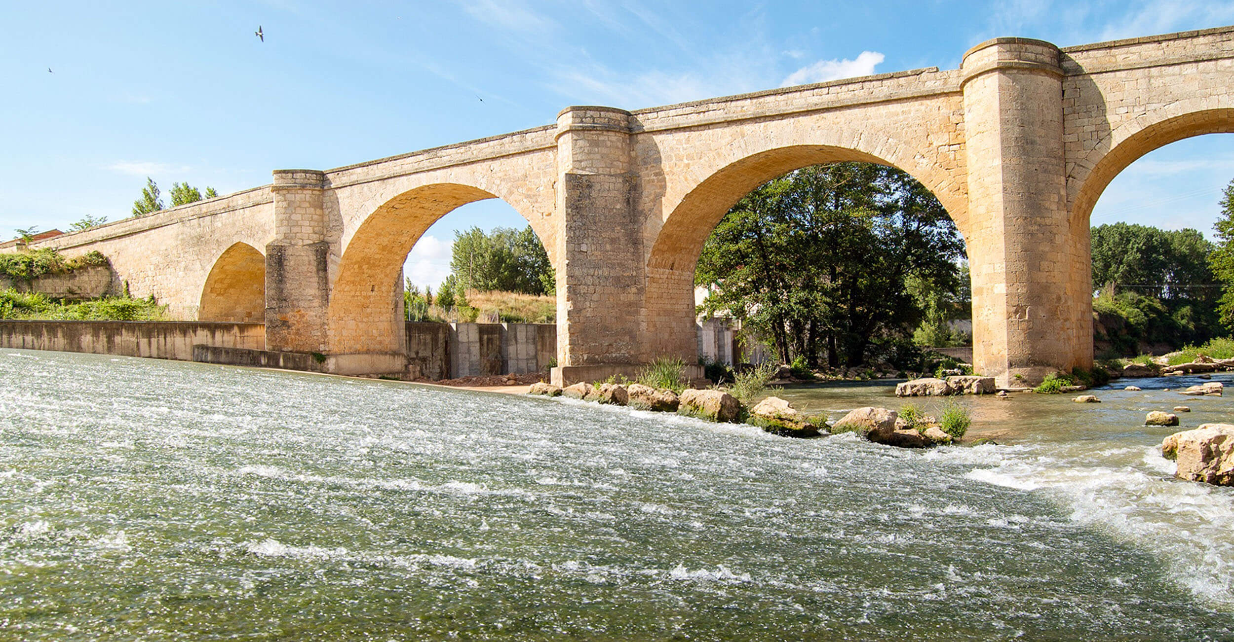 Historic stone bridge over the river, near San Martín de Rubiales